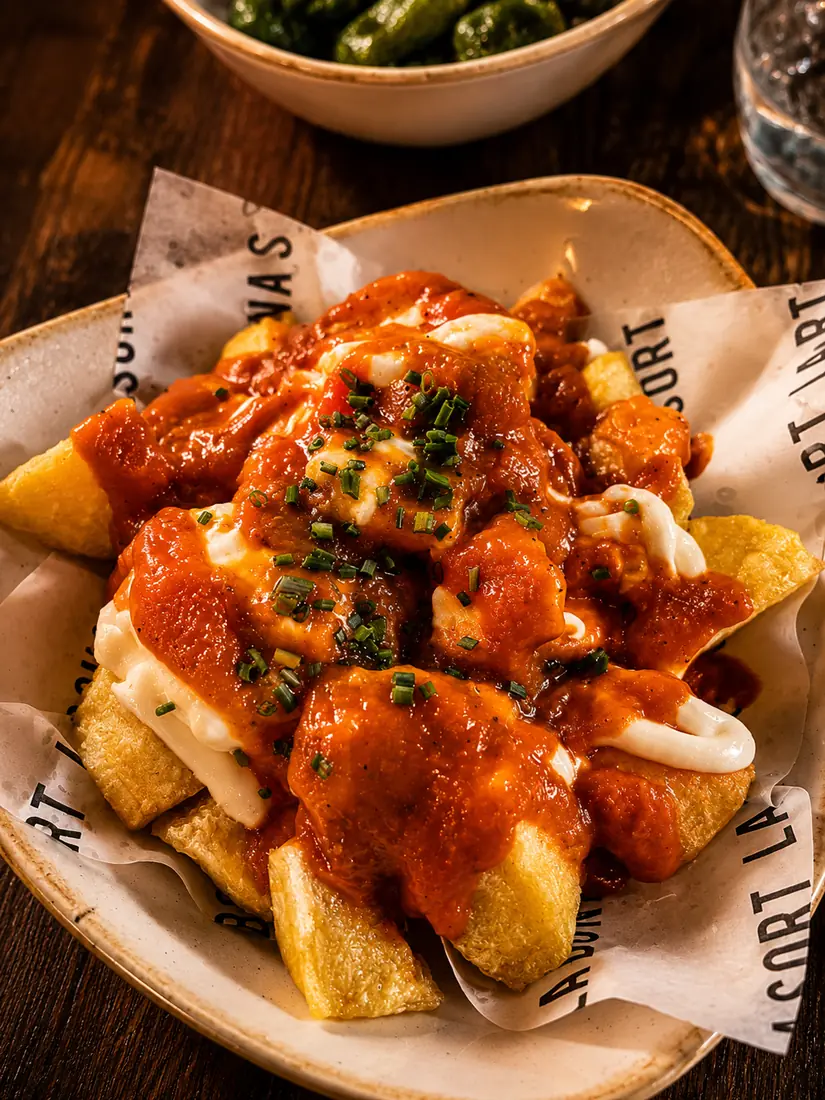 Patatas bravas served on a house plate